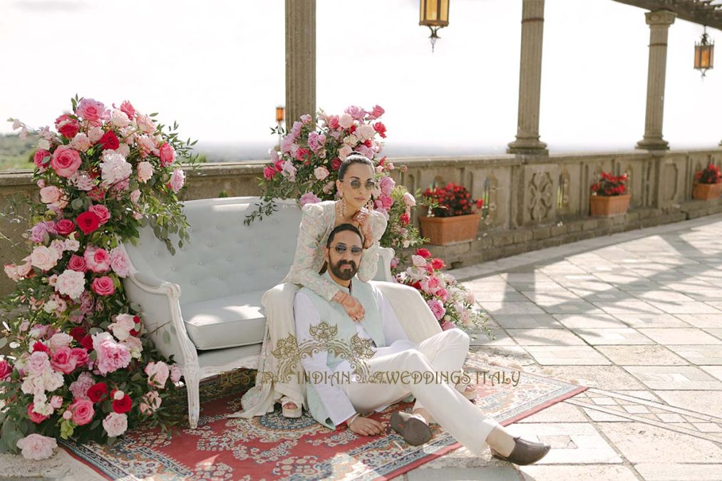 Pre-wedding photoshoot during Mehndi celebrations in Rome, Italy, featuring the couple in vibrant traditional attire.