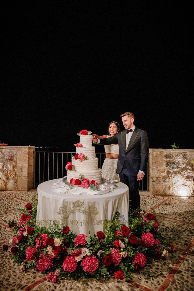 wedding cake cutting italy 682x1024 - A Cross-Cultural Fairytale in Sicily: A South-Indian Wedding Celebration Overlooking the Sea
