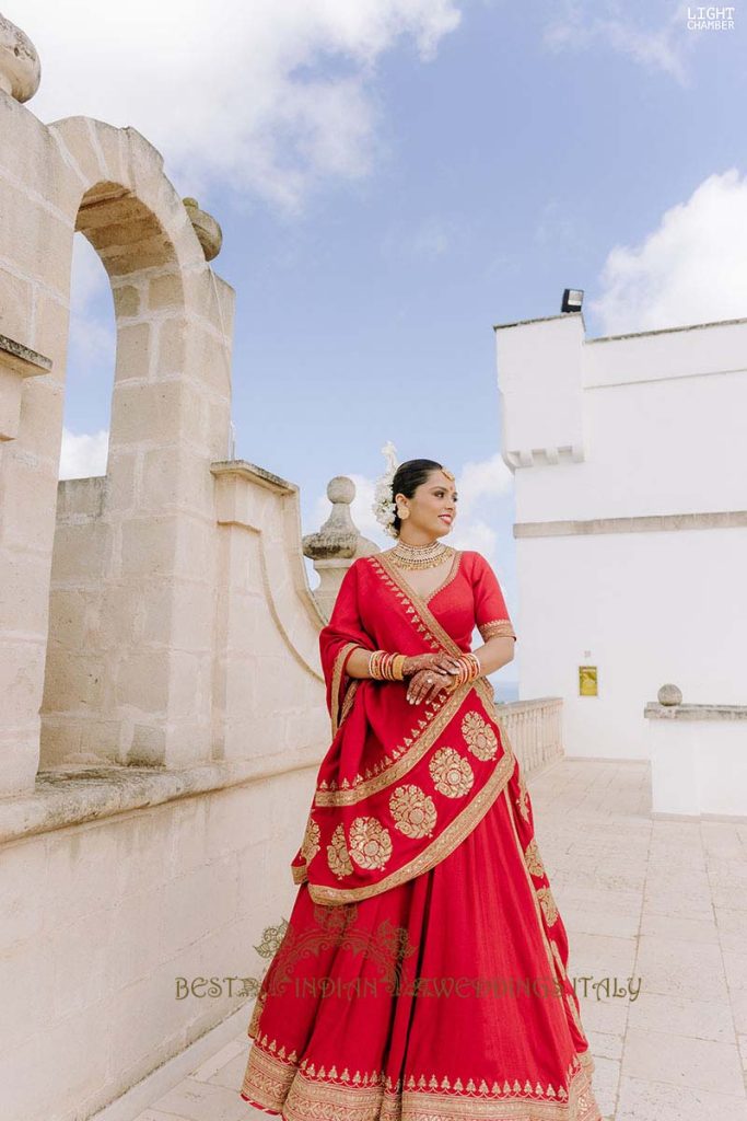 red bridal lehenga italy 683x1024 - Enchanting Indian Wedding in Puglia with A Unique Mandap Design