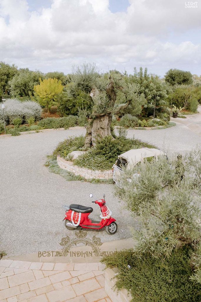 red vespa scouter baraat 683x1024 - Enchanting Indian Wedding in Puglia with A Unique Mandap Design