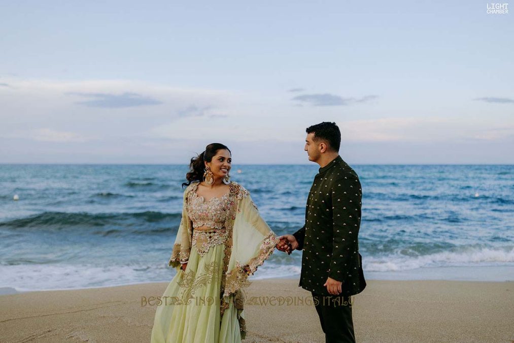 Indian couple seaside wedding Puglia with elegant beach setup